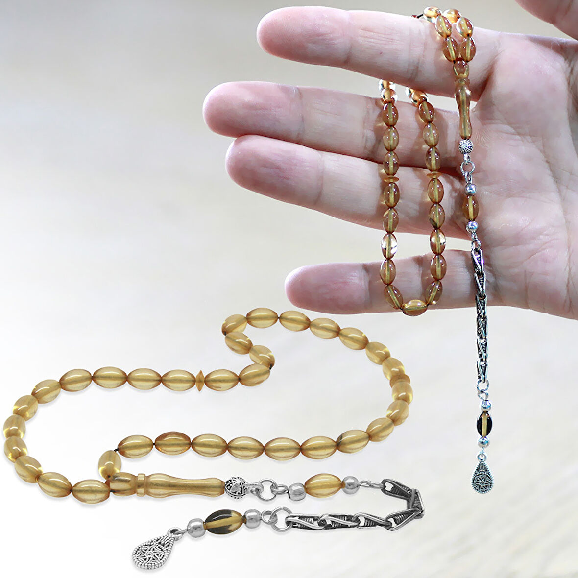 Kararmaz Metal Kafes Zincir Püsküllü Arpa Kesim Şeffaf Renk Bilek Boy Ateş Kehribar Tesbih