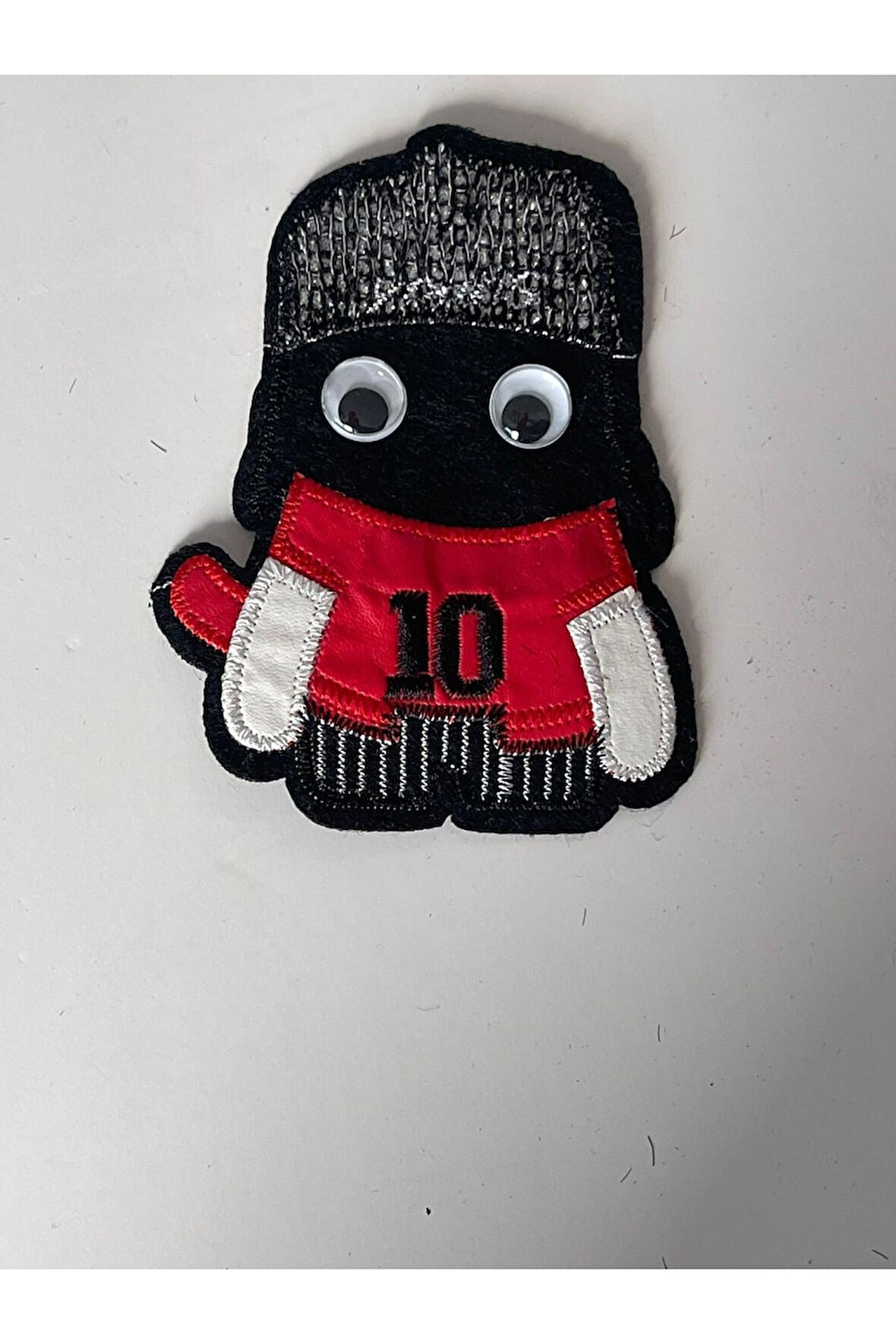 12X7 CM OYNAYAN GÖZLÜ DERİ ÇOCUK 10 NUMARA APLİKE