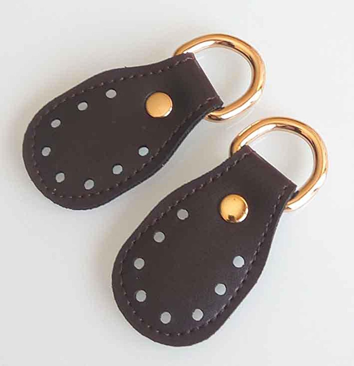 Koyu kahve renk, sapların uç kısmına dikmek için deri aparat.