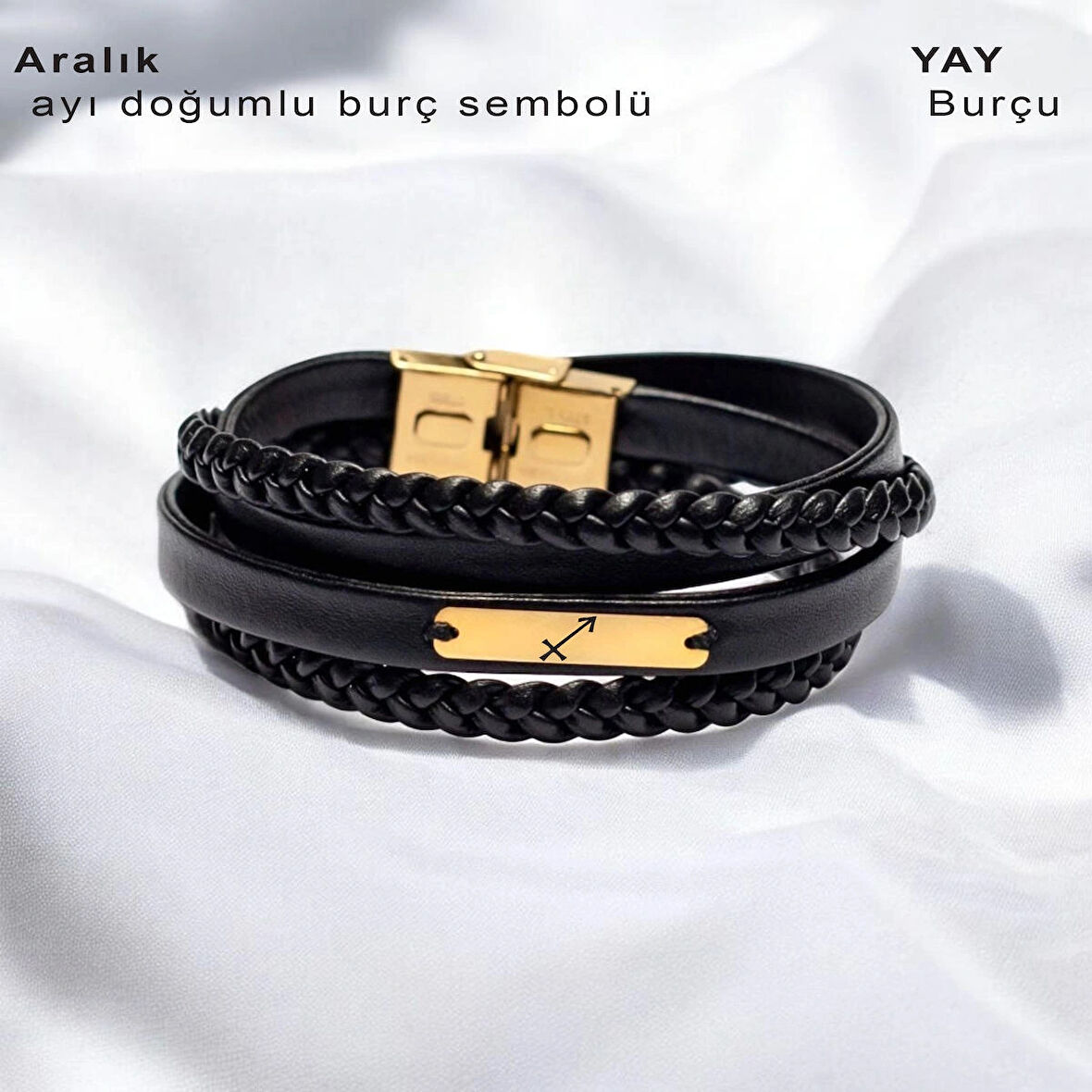 Yılbaşı Şıklığı, Siyah Deri Örgülü ve 14 Ayar Altın Kaplamalı Dikdörtgen Motifli Aralık Bilekliği