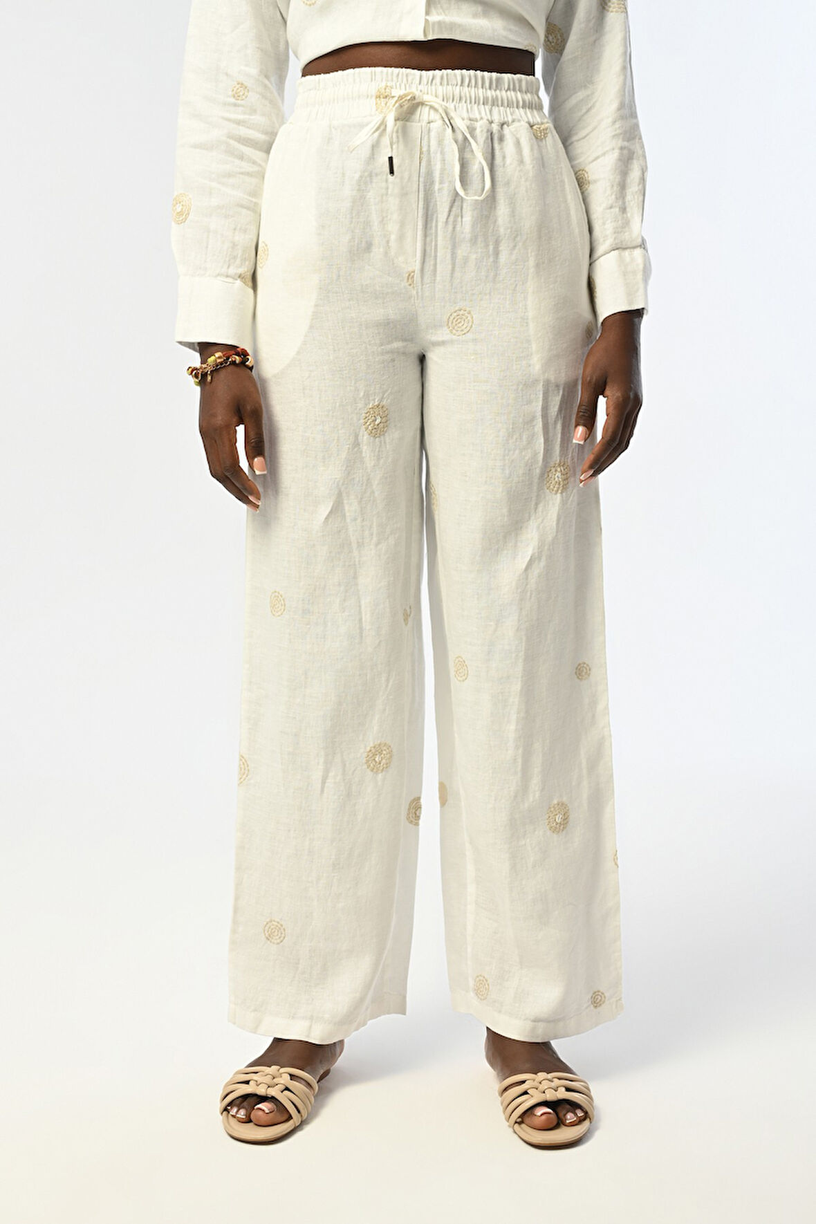 KADIN BOL PAÇA BELİ LASTİKLİ EKRU RENK DESENLİ PANTOLON