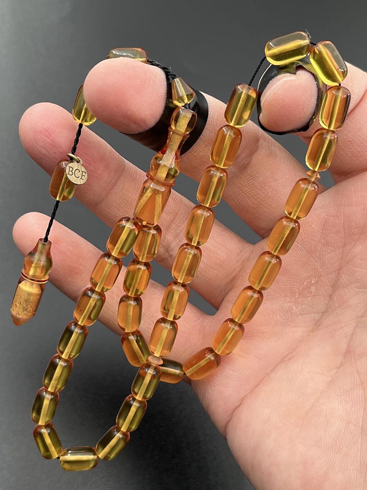 Ateş Kehribar Tesbih Sarı Kapsül Model 7x11mm 33 Tane Sistemli Tane Boşlukları Ayarlanabilir Püskül AK04075.180324