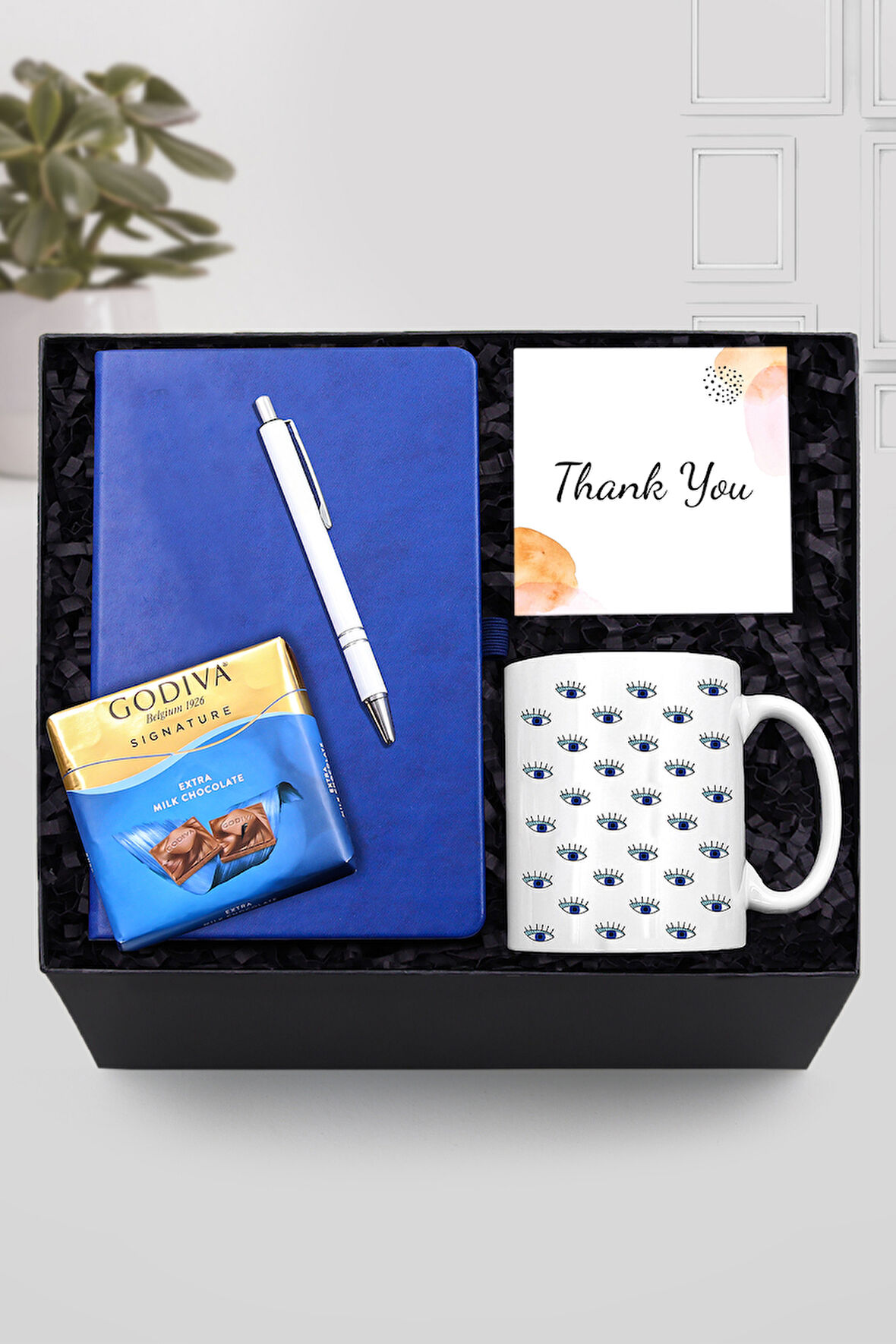 Mavi Defter & Nazar Boncuklu Göz Kupa & Gümüş Renk Detaylı Beyaz Tükenmez Kalem & Godiva Hediye Seti