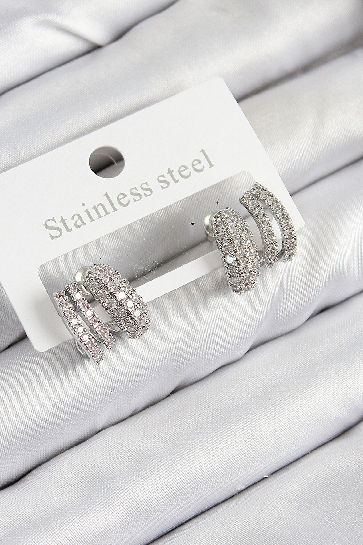 Dodes Dodes Pirinç Zirkon Taşlı Kıvrımlı Model Gümüş Renk Kadın Küpe TG27BKP11113