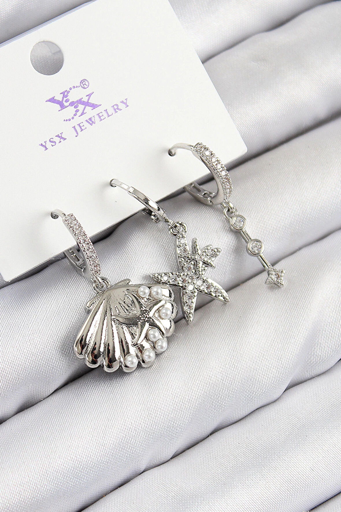 Dodes Pirinç Zirkon Taşlı 3'lü Yıldız Ve İstiridye Model Gümüş Renk Kadın Küpe TG27BKP11131