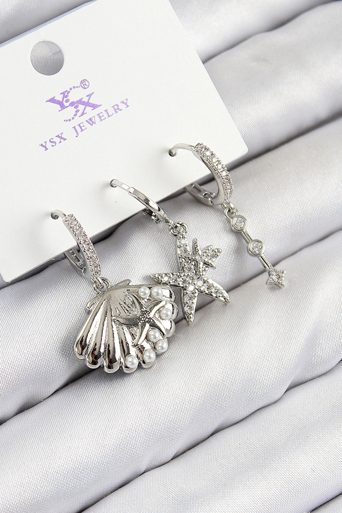 Dodes Dodes Pirinç Zirkon Taşlı 3'lü Yıldız Ve İstiridye Model Gümüş Renk Kadın Küpe TG27BKP11131