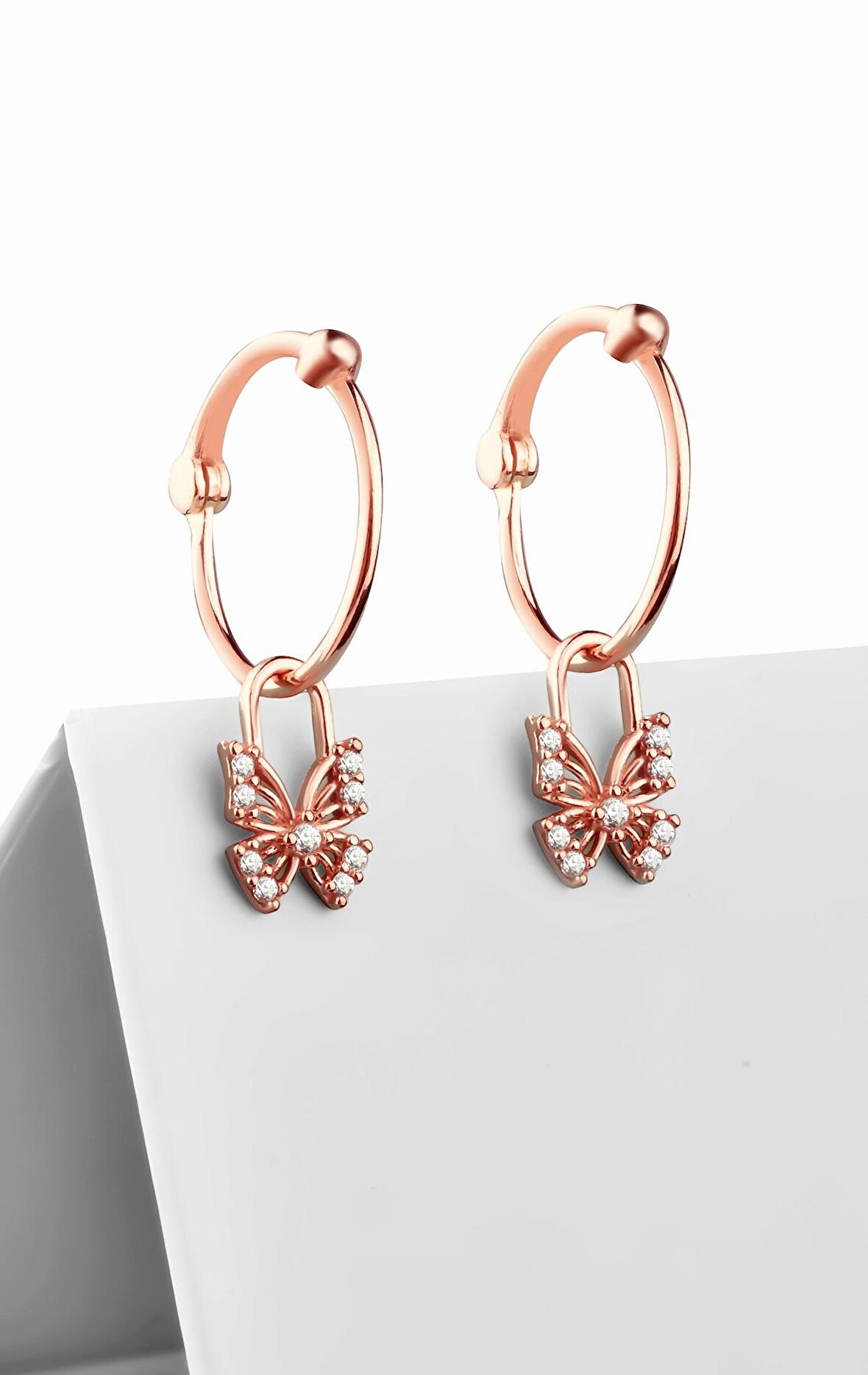 Gümüş zirkon taşlı kelebek model sallantılı rose küpe