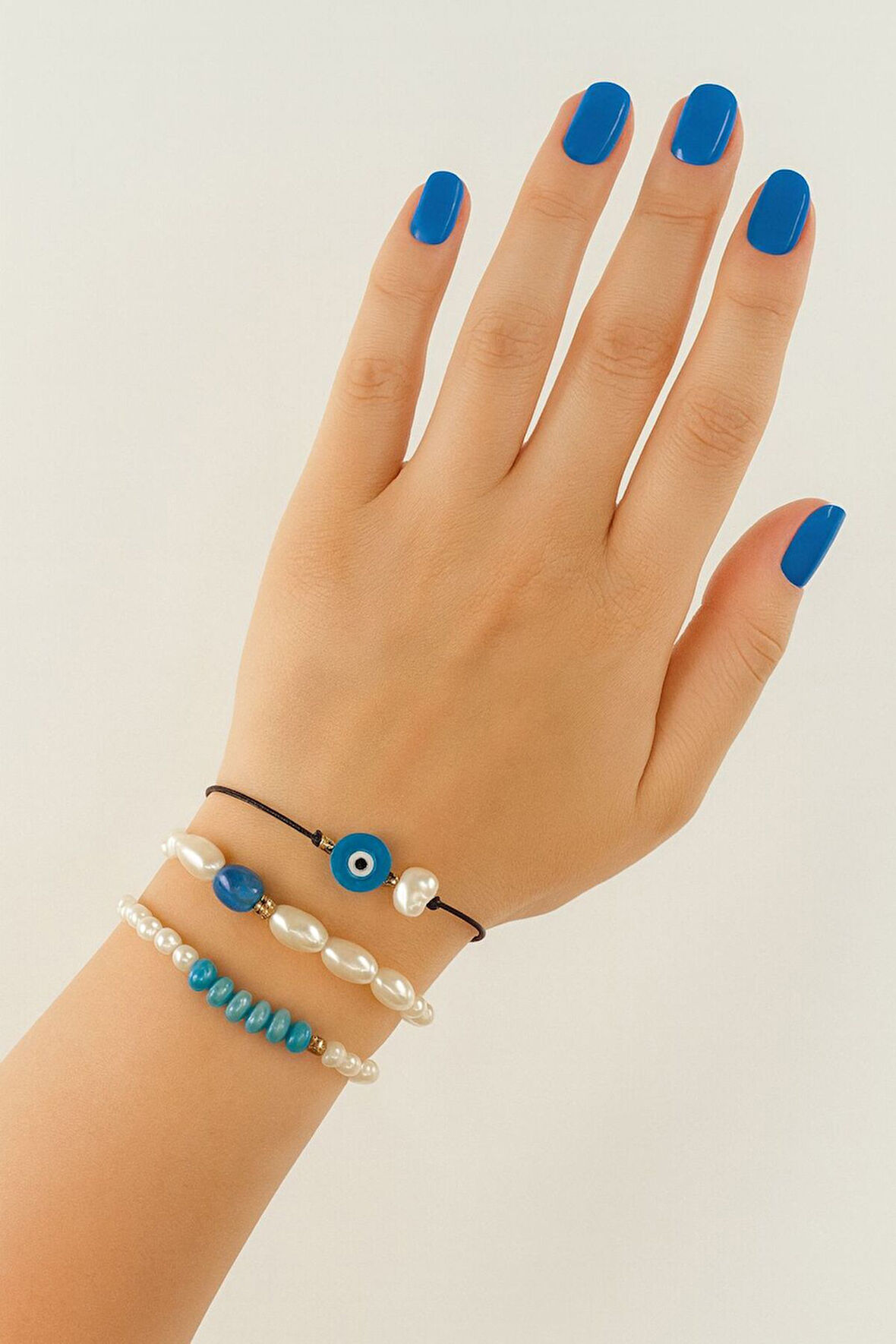 3lü nazar boncuklu incili boncuklu asansörlü lastikli ip bileklik. Kadın ip bileklik halhal