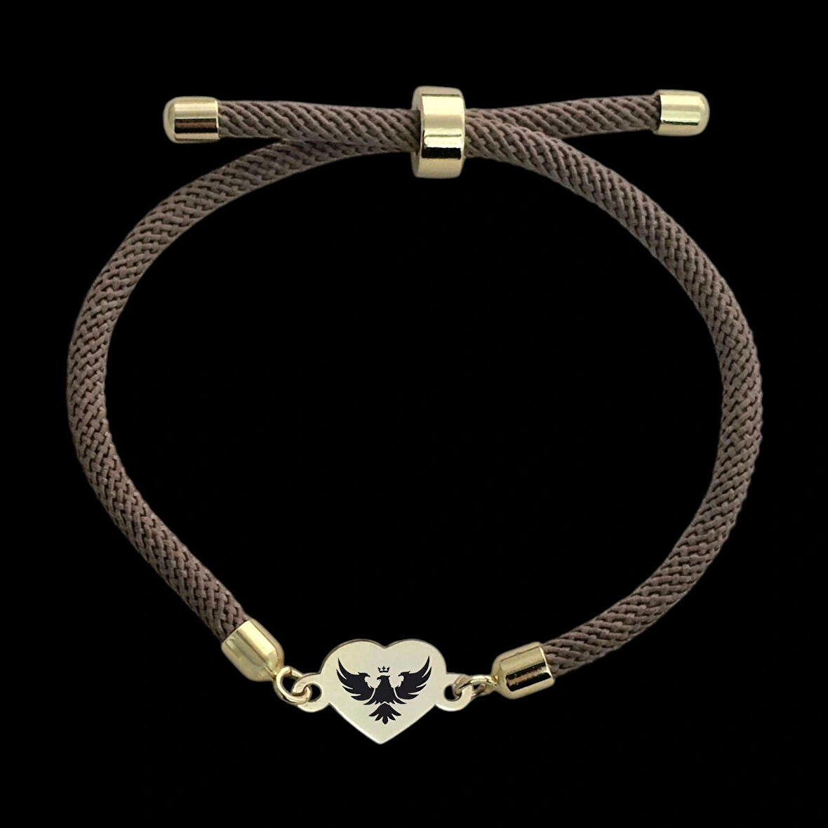 Asalet ve keskin bakışın sembolü Kalp Figürlü ve Kahverengi Örgülü 14 Ayar Altın Plakalı Kartal Bilekliği