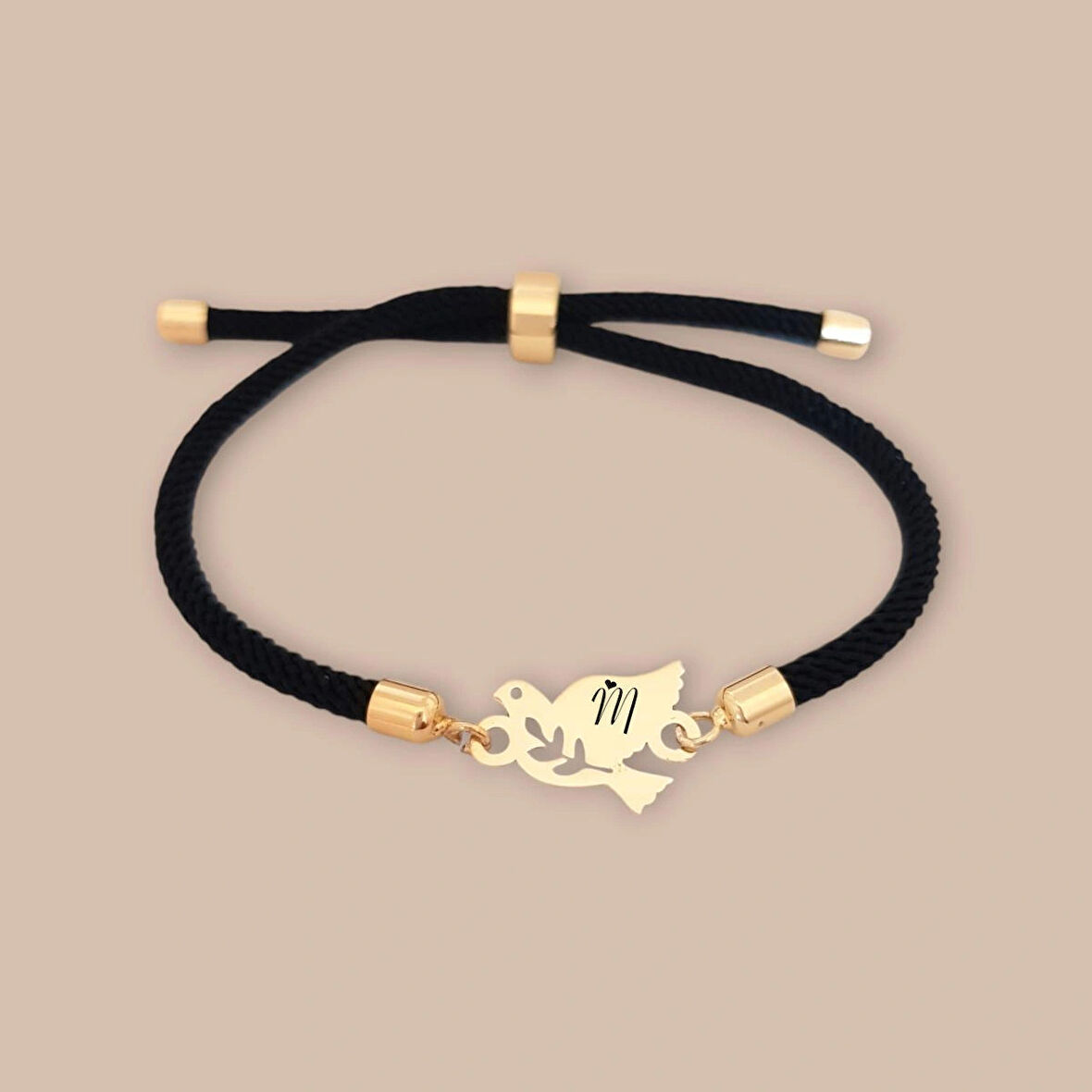 Zarif Kuş Figürlü, Siyah Örgü İşlemeli ve 14 Ayar Altın Plakalı M Bilekliği