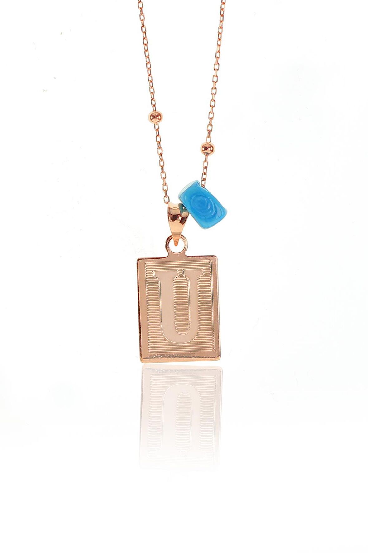 Gümüş U harfi ve turkuz taşlı top top zincirli kolye