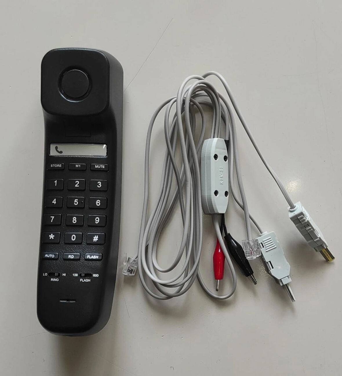 KAREL TEST TELEFONU SİYAH (KESMELİ KESMESİZ TEST KABLOLU)