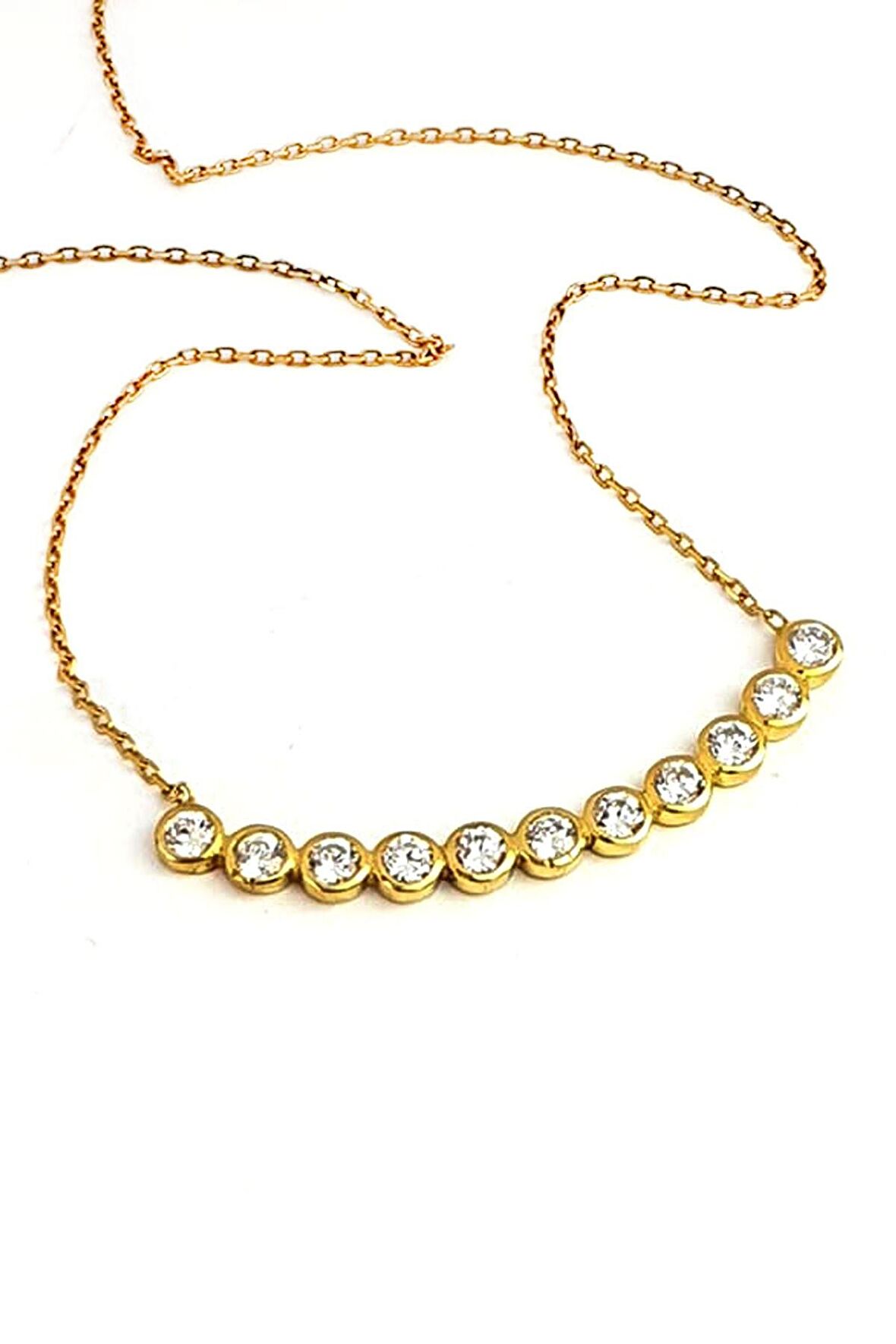 Zirkon taşlı gümüş üzerine altın kaplama yay kolye 