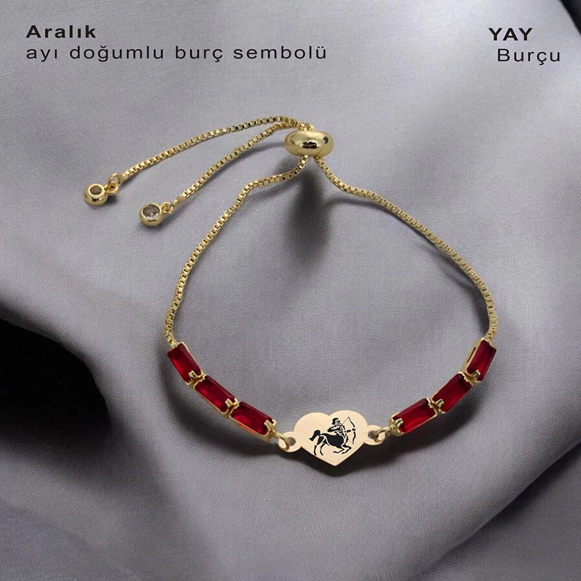Yeni Yılın Heyecanını ve Umutlarını Barındıran Kalp Motifli Kırmızı Taşlı 14 Ayar Altın Plakalı Aralık Bilekliği
