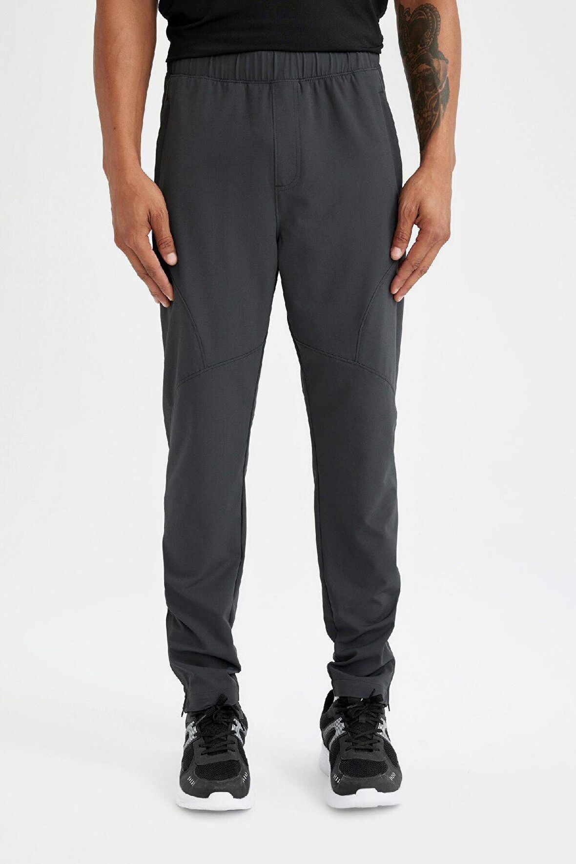 DeFactoFit Sporcu Dokuma Pantolon Slim Fit Dar Kesim Çift Cepli Fermuarlı Paça C9262AX24AUAR231