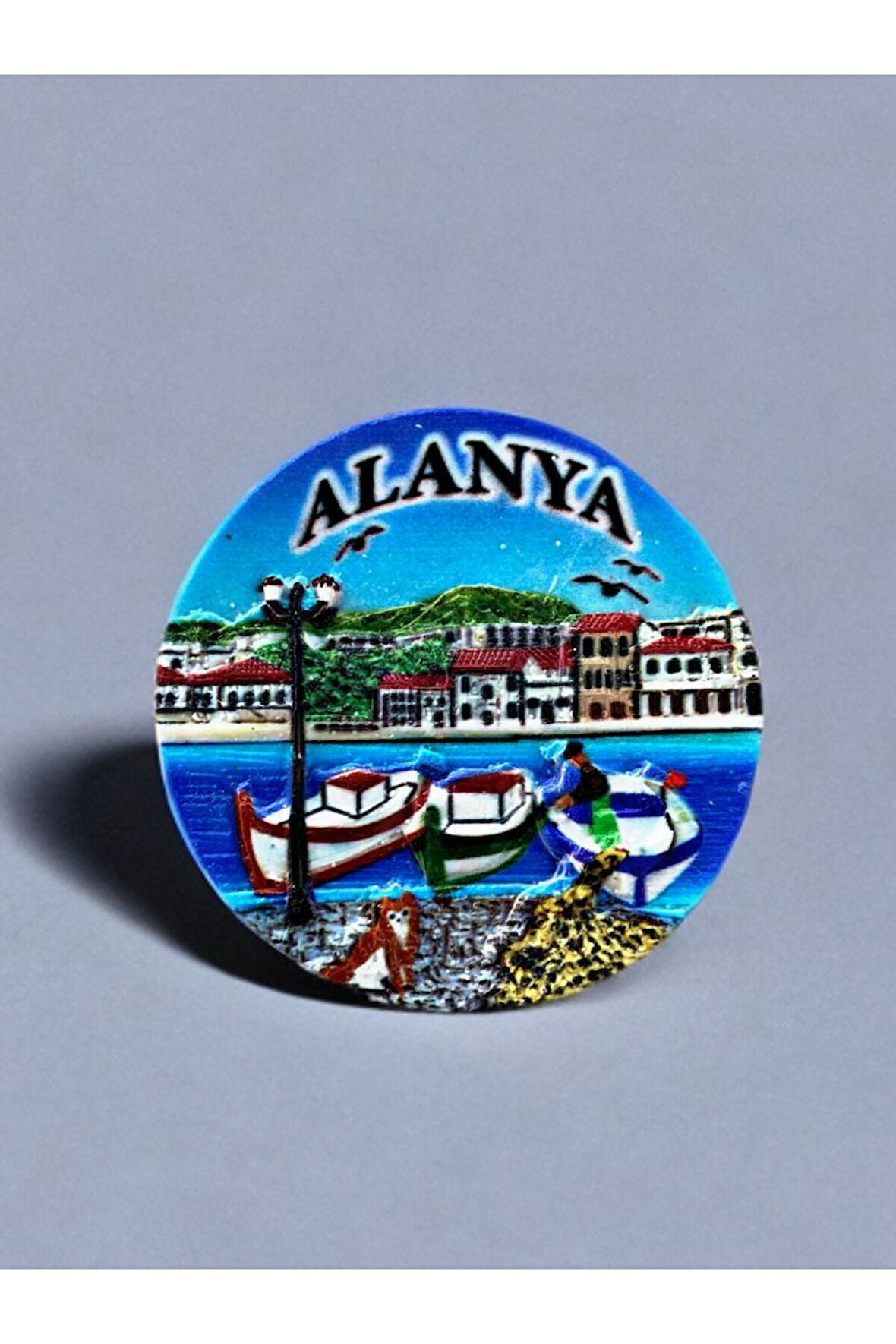 ALANYA Temalı Kabartma Polyester Magnet. 7cm çap. Mavi