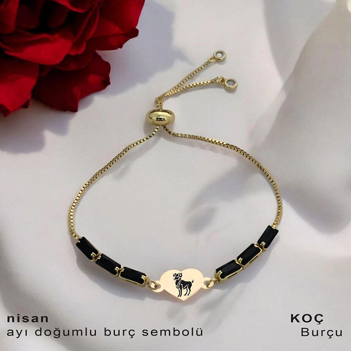 Efsane Göz Kamaştırıcı Kalp Motifli ve Işıltılı Siyah Taşlı 14 Ayar Altın Plakalı Nisan Bilekliği