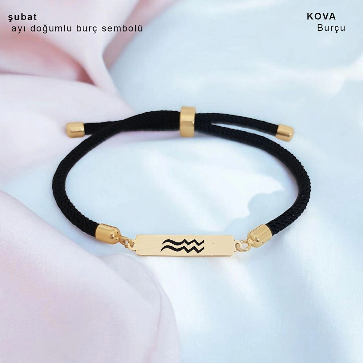 Romantizmi yansıtan Siyah Örgülü Dikdörtgen Motifli 14 Ayar Altın Plakalı Şubat Bilekliği