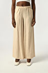 KADIN BELİ LASTİKLİ BOL PAÇA KIRIŞIK KUMAŞ DÜZ RENK PANTOLON