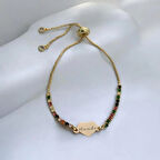 Parlak Kalp Figürlü ve Renkli Taşlı 14 Ayar Altın Plakalı Hande Bilekliği