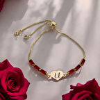 Zarif Kalp Motifli ve Şeffaf Kırmızı Taşlı 14 Ayar Altın Plakalı U Bilekliği