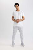 DeFactoFit Sporcu Jogger Eşofman Altı Slim Fit Dar Kesim Çift Cepli Standart Paça Dokuma B5157AX24SPGR91