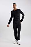 DeFactoFit Dokuma Esnek Multifonksiyonel Sporcu Jogger Eşofman Altı Slim Fit Dar Kesim Çift Cepli C1212AX23WNBK81