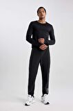 DeFactoFit Dokuma Esnek Multifonksiyonel Sporcu Jogger Eşofman Altı Slim Fit Dar Kesim Çift Cepli C1212AX23WNBK81