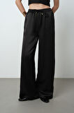 Kadın Düz Renk Parlak Kumaş Bol Paça Beli Lastikli Pantolon