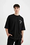 DeFacto Loose Fit Bisiklet Yaka Sırt Baskılı Kısa Kollu Tişört C2244AX24SMBK81