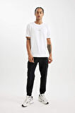 DeFactoFit Dokuma Esnek Multifonksiyonel Sporcu Jogger Eşofman Altı Slim Fit Dar Kesim Çift Cepli C1212AX24AUBK81