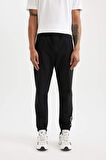 DeFactoFit Dokuma Esnek Multifonksiyonel Sporcu Jogger Eşofman Altı Slim Fit Dar Kesim Çift Cepli C1212AX24AUBK81