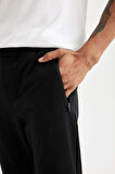DeFactoFit Dokuma Esnek Multifonksiyonel Sporcu Jogger Eşofman Altı Slim Fit Dar Kesim Çift Cepli C1212AX24AUBK81
