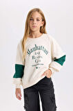 DeFacto Kız Çocuk Oversize Geniş Kalıp Bisiklet Yaka Baskılı Sweatshirt D1106A824AUER233