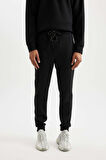 DeFactoFit Sporcu Jogger Eşofman Altı Slim Fit Dar Kesim Skuba Dalgıç Kumaş Standart Paça C0485AX24AUBK81