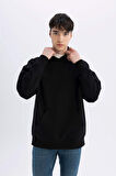 DeFacto Siyah Oversize Geniş Kalıp Kapüşonlu Kanguru Cepli Basic Düz Sweatshirt A4331AX24AUBK81