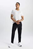 DeFactoFit Sporcu Jogger Eşofman Altı Slim Fit Dar Kesim Dokuma Üç Cepli Fermuarlı Paça B2780AX24SMBK81