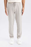 DeFacto Yazlık Jogger Pantolon Slim Fit Dar Kesim Beli Bağcıklı Cepli Düz Paça D8638AX24AUGR107