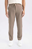 DeFacto Yazlık Jogger Pantolon Slim Fit Dar Kesim Beli Bağcıklı Cepli Düz Paça D8638AX24AUBN586