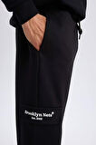 DeFactoFit NBA Brooklyn Nets Jogger Eşofman Altı Standart Fit Cepli Skuba Dalgıç Kumaş Beli Bağcıklı Lastikli Paça D8677AX25SPBK81