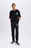 DeFactoFit NBA Milwaukee Bucks Kalın Jogger Eşofman Altı Standart Fit Cepli Beli Bağcıklı Lastikli Paça D6692AX25SPBK82