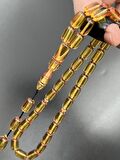 Ateş Kehribar Tesbih Sarı Kapsül Model 7x11mm 33 Tane Sistemli Tane Boşlukları Ayarlanabilir Püskül AK04075.180324