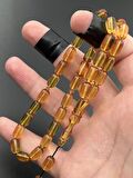 Ateş Kehribar Tesbih Sarı Kapsül Model 7x11mm 33 Tane Sistemli Tane Boşlukları Ayarlanabilir Püskül AK04075.180324