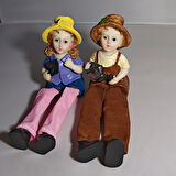 Sallanan Ayaklı Kürek Taşıyan ve Sulama Kabı Tutan Çocuk Biblosu