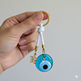 Cam Nazar Boncuklu Lotus Çiçekli Beyaz İpli Anahtarlık