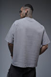 Kabaran Baskılı Reglan Kol Oversize Kalıp Tişört