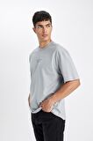DeFacto Oversize Fit Bisiklet Yaka Sırt Baskılı Kısa Kollu Tişört D4909AX24AUGR130