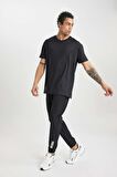DeFactoFit Dokuma Esnek Multifonksiyonel Sporcu Jogger Eşofman Altı Slim Fit Dar Kesim Çift Cepli C1212AX24SPBK81