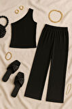 Kadın Siyah Tek Omuzlu Şık Bluz & Geniş Paça Pantolon İkili Takım - Modern, Konforlu ve Günlük Kombinlere Uygun