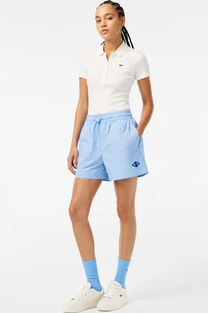 Lacoste x Netflix Women's Monogram Bermuda Shorts Kadın Monogram Hafif Kumaş Bermuda Şort Açık Mavi